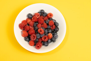 Fresh Raspberries and Blueberries in a White Bowl – Healthy Summer Fruits