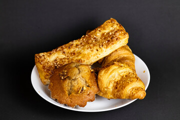 Flaky Croissant with Fresh Berries and Banana on Vibrant Yellow