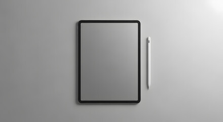 Minimal top-down shot of a digital tablet with a white stylus placed neatly on a light gray matte background. Clean, elegant, modern workspace concept.
