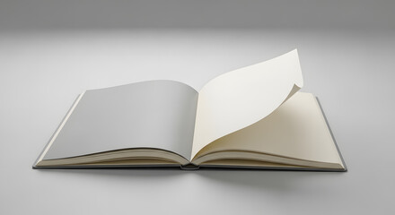 Minimal image of an open notebook with one corner of a page softly curled, placed on a light gray background, symbolizing beginnings or process.