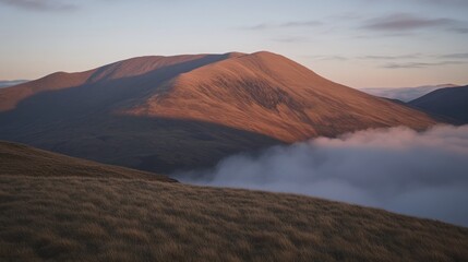 A majestic mountain range illuminated by the early morning sunlight