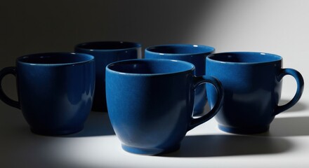 Group of dark blue mugs