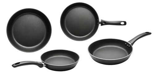 a set of four black frying pans in a studio shot