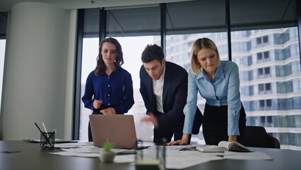 Stressed coworkers frustrated problem reading laptop email. Tensed colleagues 