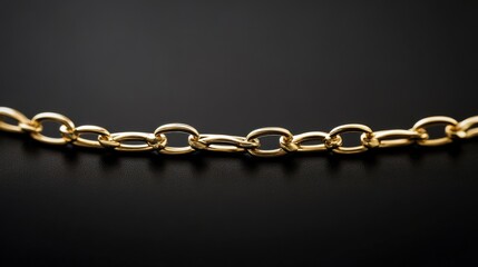 Obraz premium Elegant Gold Chain on Black Surface