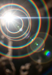 Radiant orb of light surrounded by circular spectrums, capturing luminescence