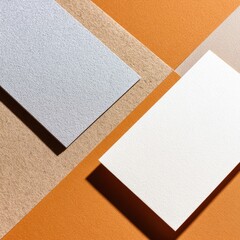 Fototapeta premium Three business cards, light and shadow on a vibrant orange background