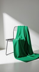 Emerald fabric draped over chair