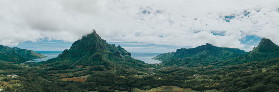 Panoramic view of Mount Rotui and lush valleys on Moorea Island, Tahiti.