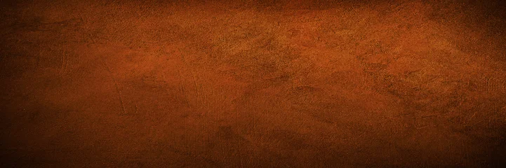 Black dark red brown burnt orange rough grunge texture background. Toned concrete wall surface. Close-up. Space for design. Wide banner. Panoramic. © Наталья Босяк