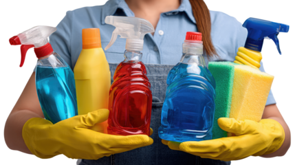 Essential Cleaning Essentials: A domestic employee in yellow gloves meticulously organizes an array of colorful cleaning products, including spray bottles and sponges.