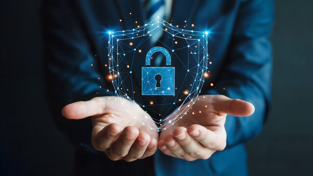 Professional hands hold glowing digital shield with padlock symbolizing cybersecurity and data protection innovation