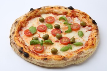 Delicious pizza with tomatoes, olives and basil on white table, closeup