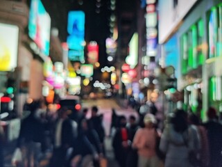 Obraz premium Abstract bokeh image of crowded Hong Kong street at night with neon lights.