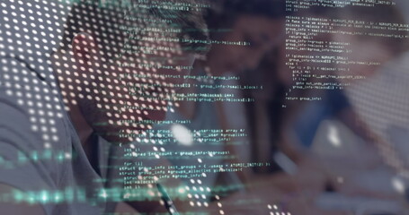 Writing developer taking notes on notebook at desk, showing code overlay, tablet, copy space