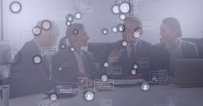 Discussing executive team gesturing and typing at conference room, with laptop and digital overlays