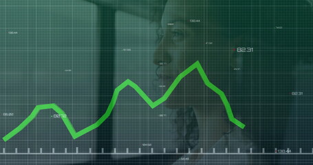 Businesswoman analyzing green line graph on digital screen in modern office, copy space
