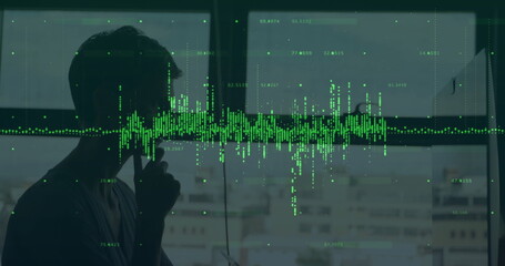 Talking on smartphone silhouette man by office window, green waveform overlay, markers, copy space