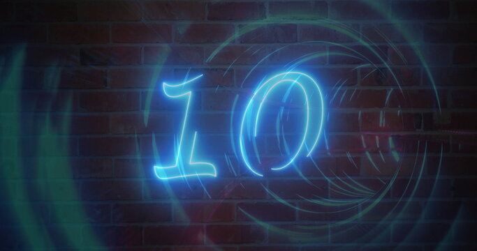 Fototapeta Shining neon blue numeral ten on interior red brick wall, with swirling teal-blue light rings