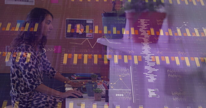 Female data analyst analyzing charts at office desk, with computer monitor coffee mug, copy space