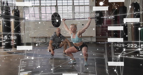 Lifting loaded barbell overhead female athlete training in gym, with grid windows digital overlay