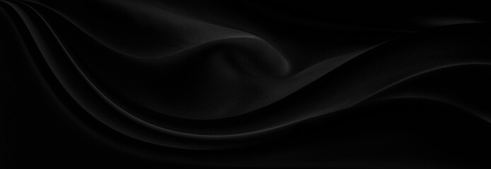 Black gray satin dark fabric texture luxurious shiny that is abstract silk cloth panorama background with patterns soft waves blur beautiful.