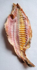 Dried fish fillet on light background