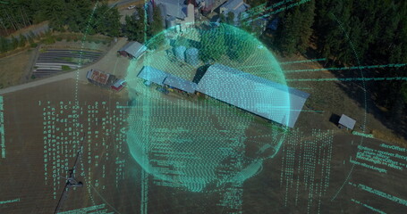 Fototapeta premium Displaying digital wireframe sphere hovering over grassy field with barn and forest, code streams