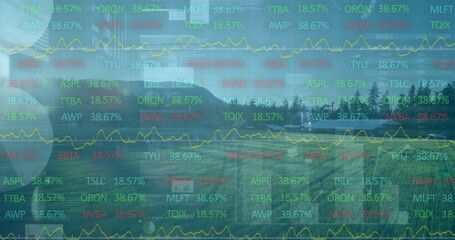 Overlaying stock tickers, percentages, yellow line charts over barns, fields, trees and mountains