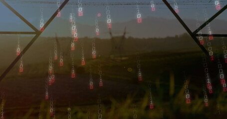 Falling binary code digits streaming over grassy field at dusk, with lattice towers and power lines