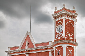 Municipal building with clock tower and triangular pediment in Bernal, Mexico