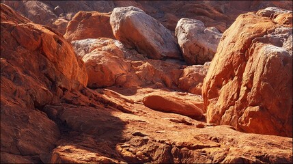 Rocky desert landscape with orange rocks and shadows