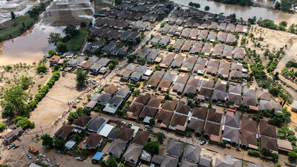 Aerial view of housing estate in suburb of Chiang Rai province flooded by Kok river rising after...