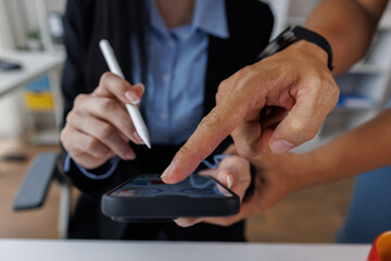 Business asian woman working at office with tablet and document, doing planning analyzing the financial report, business plan investment, finance analysis concept. Economic business discussions.
