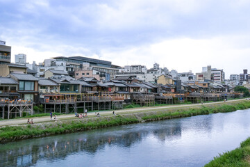Fototapeta premium Kamogawa river’s west bank near the Shijo-Ohashi bridge in Kyoto