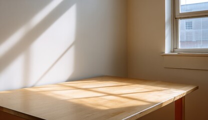 Fototapeta premium Sunlight streams through a window illuminating a simple wooden table creating a bright and inviting atmosphere in an empty room suggesting