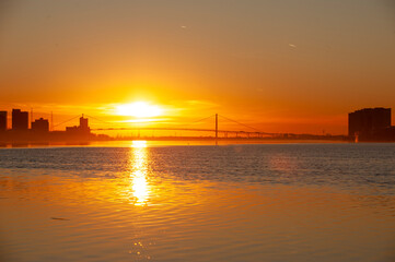 Waiting for the sun setting under the Ambassador Bridge in Detroit Michigan view from the Belle Isle sunset point