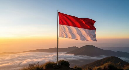 National flag at sunrise over mountains