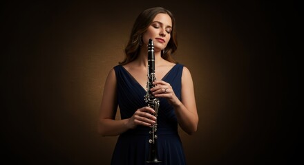 Naklejka premium Elegant woman with eyes closed holding a clarinet in a studio music portrait evoking musical passion and timeless beauty