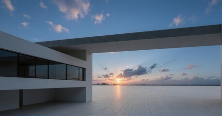 Fototapeta premium Modern architectural structure overlooking a serene sunset over the sea