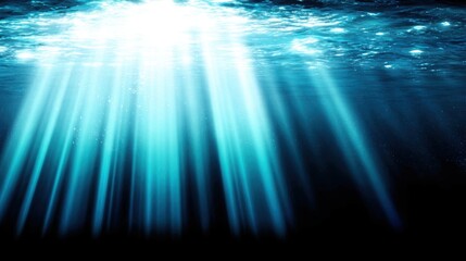 Sunlight streams through ocean waves, creating a mesmerizing play of light and shadow in deep blue waters.