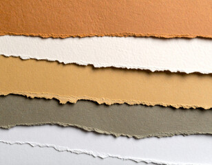 A collage of layered handmade paper in warm neutrals — torn edges, fibrous textures