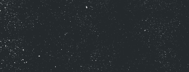 Dark black background with a speckled texture, resembling a starry night. The black background adds depth and a cosmic feel. Speckled wall texture background. Black background vector.