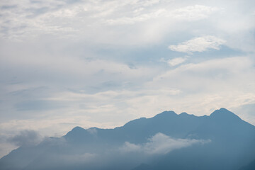 Majestic mountains rise above the clouds in DuJiangYan
