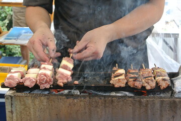 chef preparing yakitori on the grill
