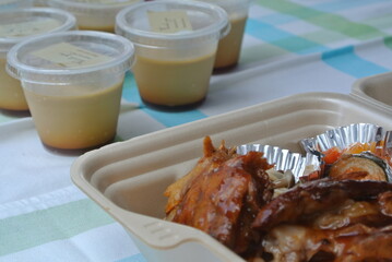 pork chop in bento box with dessert