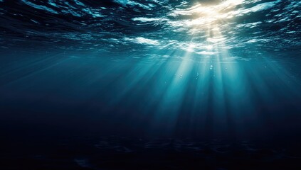Obraz premium Sunlight beams underwater, dark ocean depths