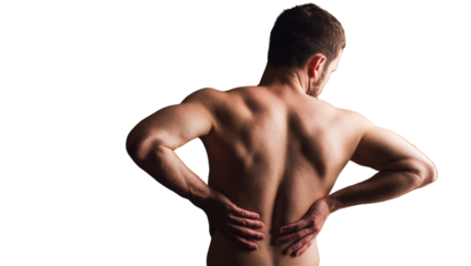 A shirtless man stands with his back turned, one hand on his lower back, indicating discomfort or pain.
