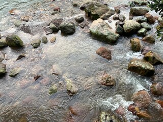 flowing river with stone and rock