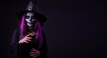 Woman with skeleton face paint and purple hair, wearing a witch hat and black clothing, poses against a dark background.